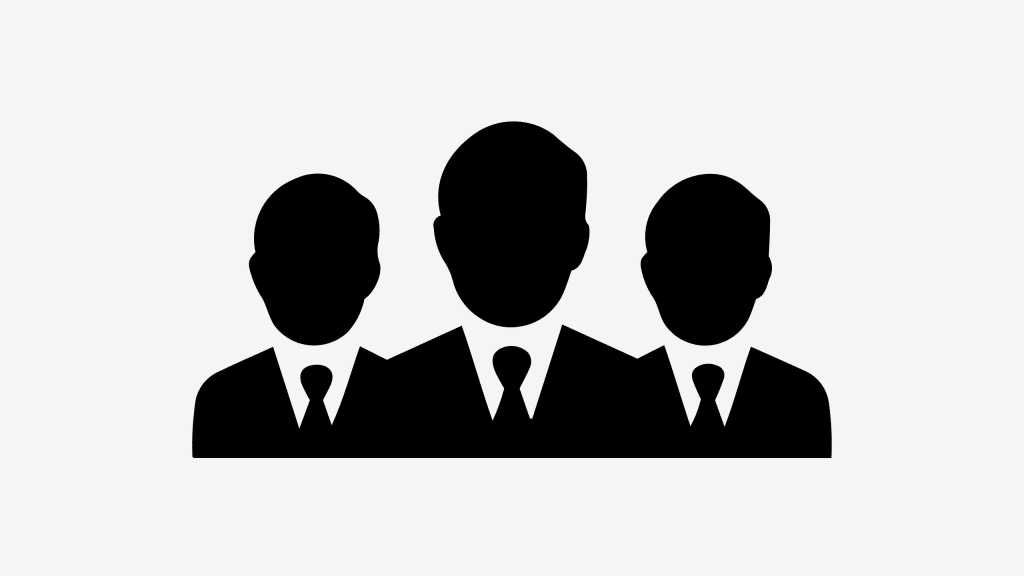 Un groupe d'hommes en costume - qui sommes-nous ?